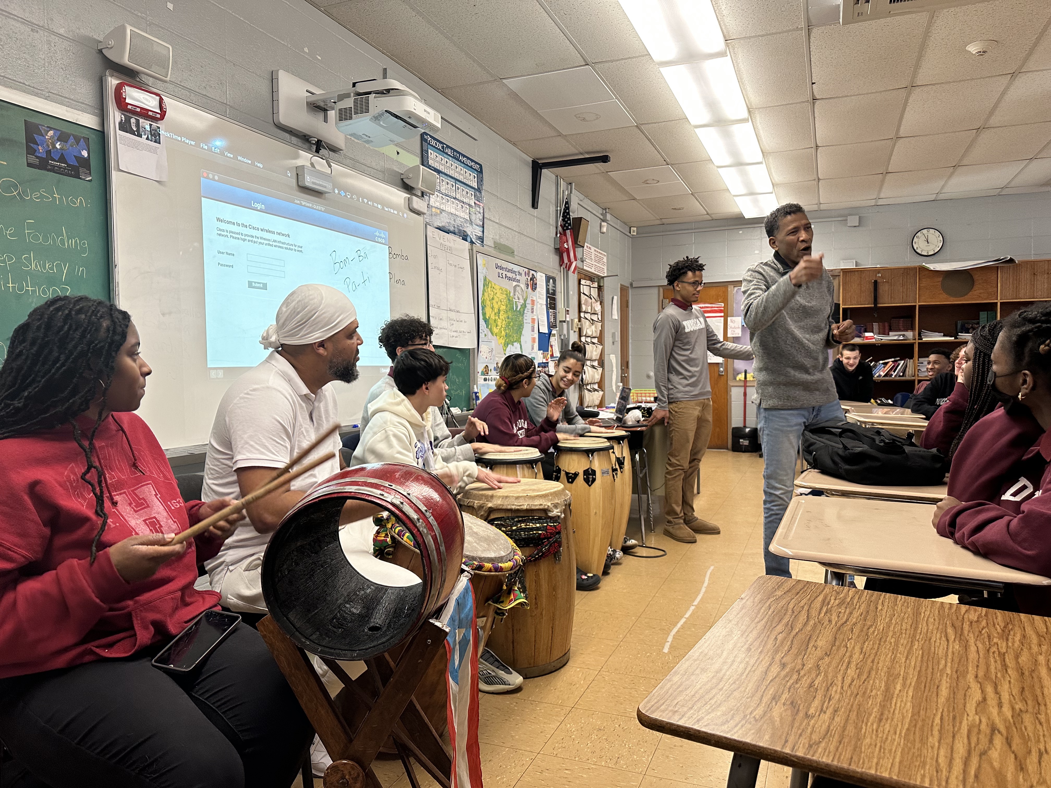 William Cepeda leading students in a classroom percussion workshop