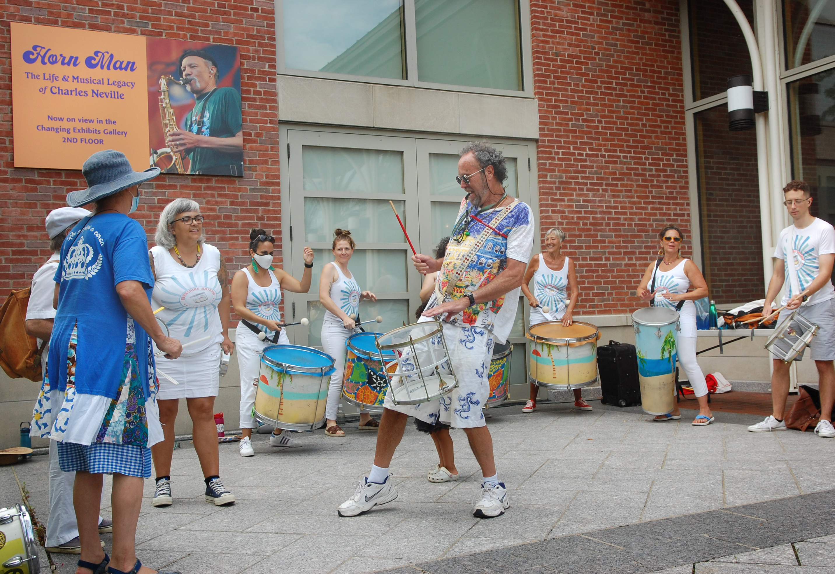 Participants making music at a festival percussion workshop