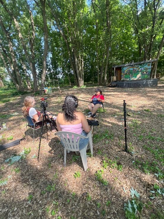 A community interview being filmed outdoors for Beyond the Storm