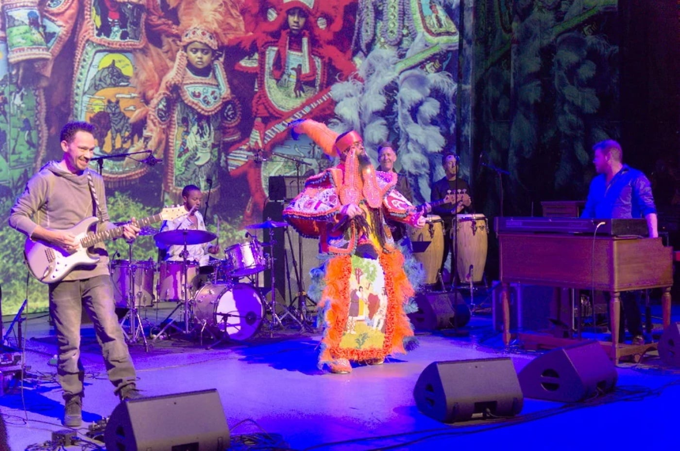 Musicians on stage at Take Me to the River